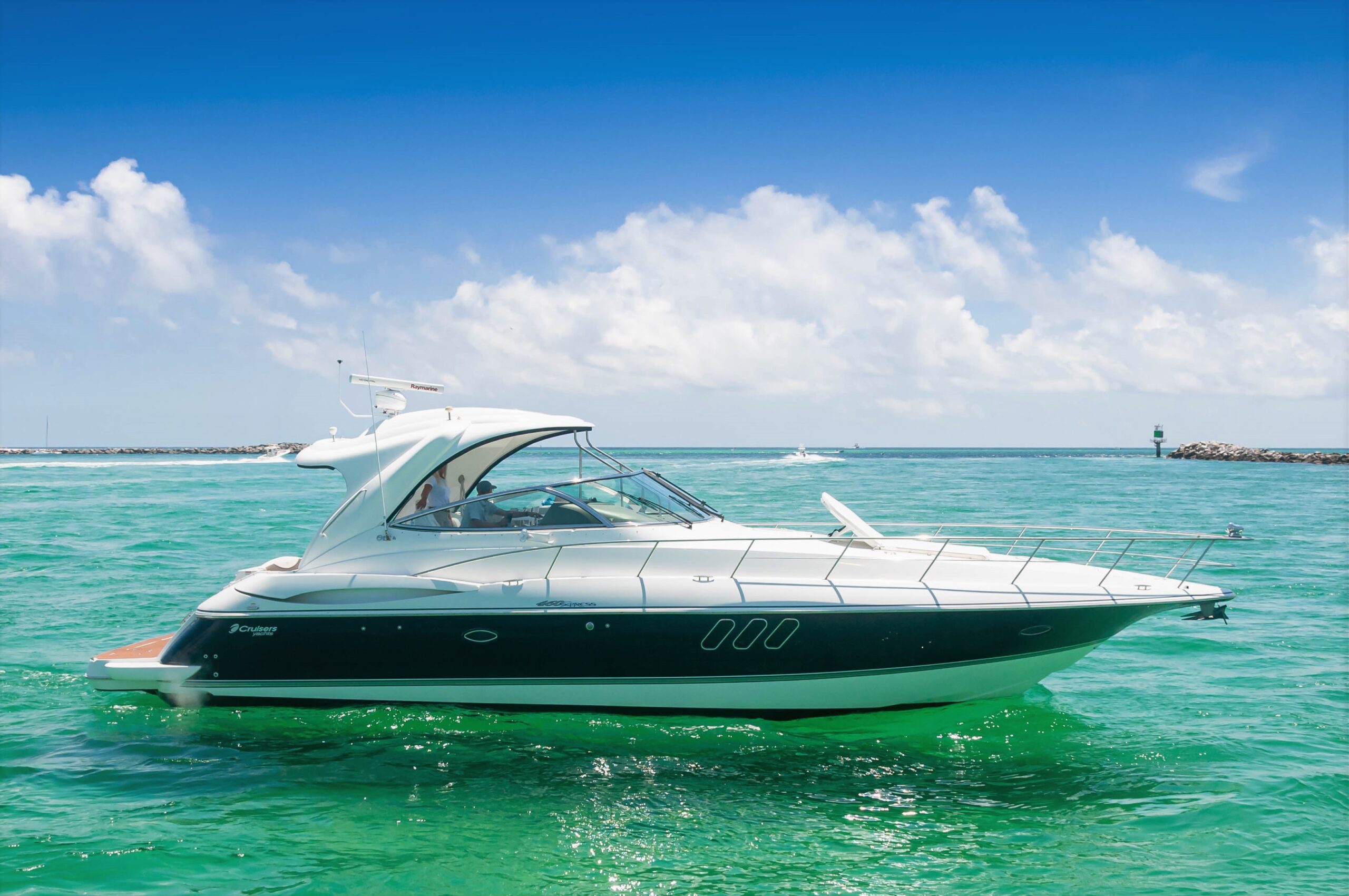 The Miss B Haven cruising on emerald-green water in Destin